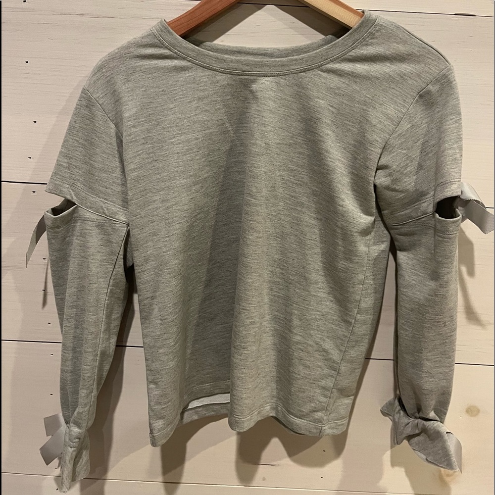 Grey long sleeve shirt with bows on it, brand Truly Me